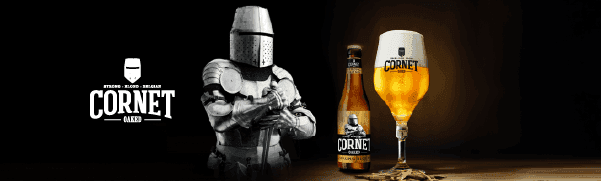 Cornet beer bottle and glass beside a knight in shining armor.