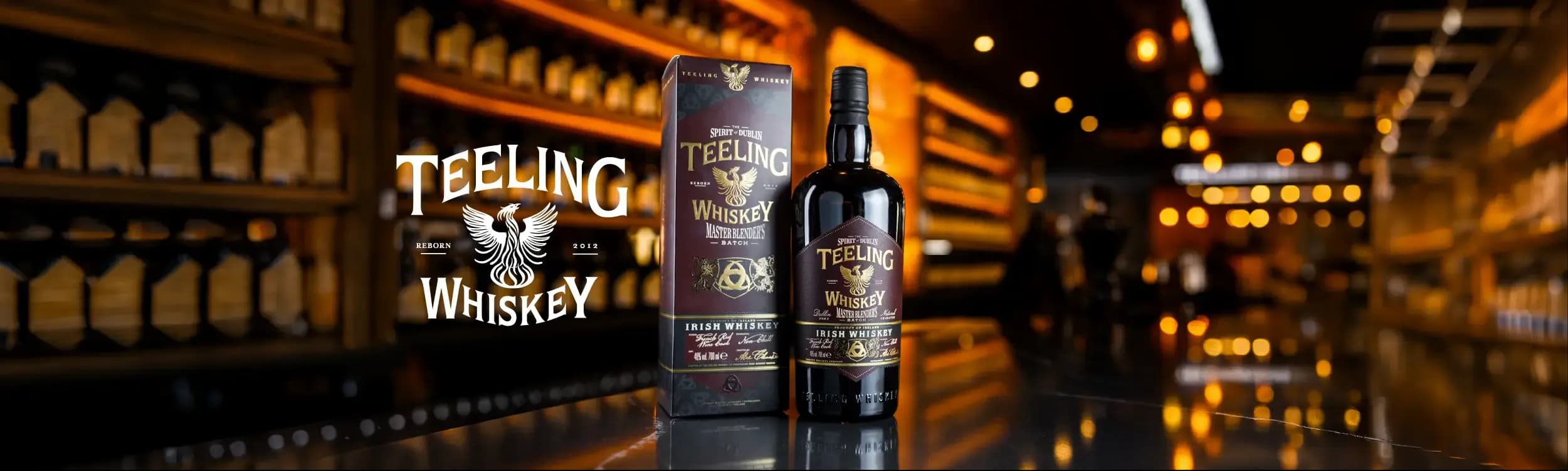 Teeling Whiskey bottle and box on a bar with glowing shelves in the background.